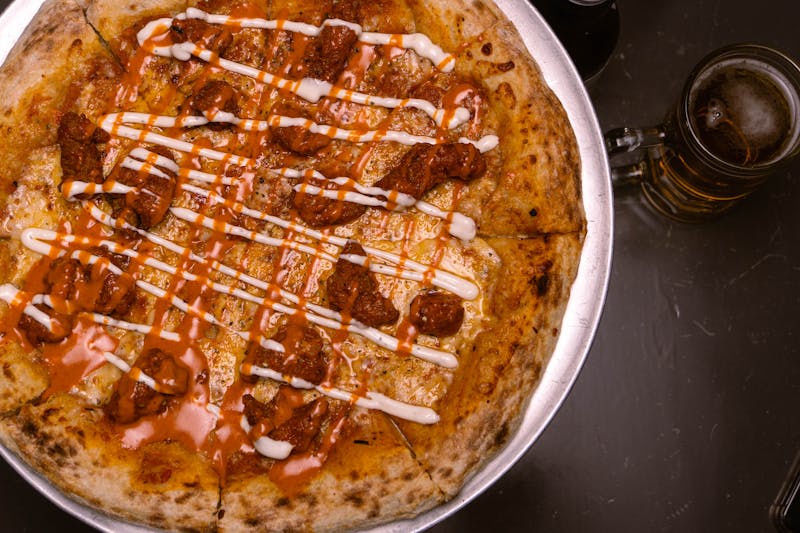 Mad Dog hot chicken mod pizza with buffalo sauce