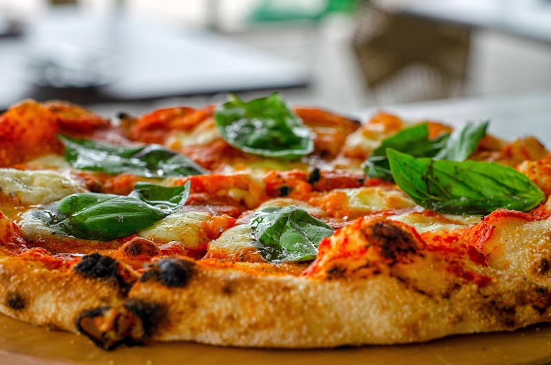 Classic Margherita mod pizza with fresh basil and mozzarella