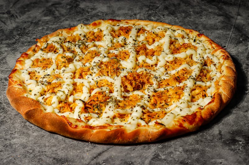 Spicy sausage and jalapeno mod pizza with hot sauce